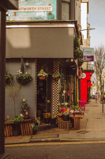 A floral arrangement from flowerslimehouse.co.uk displayed outside a charming shop on Narrow Street, Limehouse E14, featuring a bouquet of fresh mixed flowers including roses, tulips, and chrysanthemu